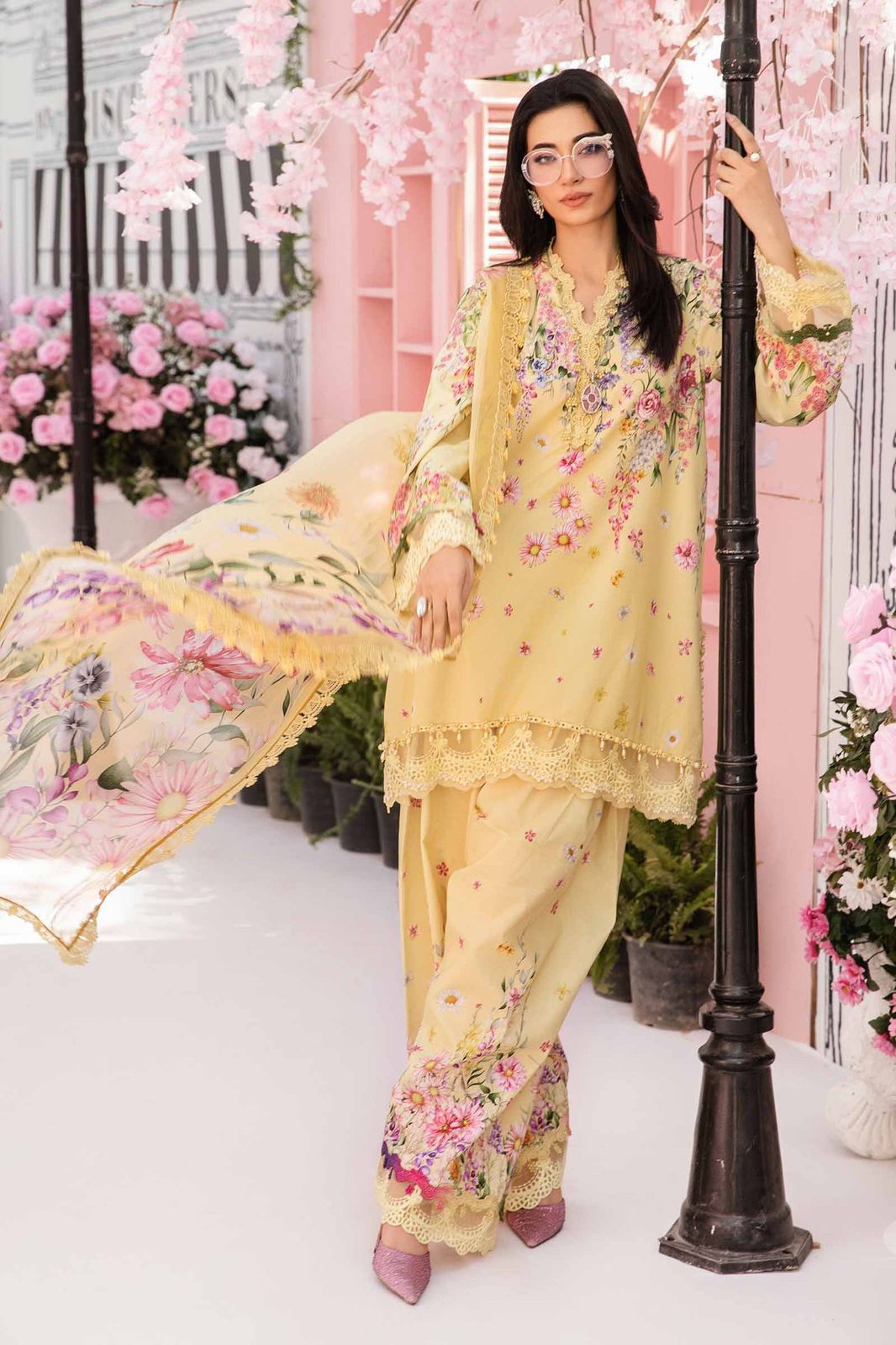 Model wearing Maria B lawn 3-piece embroidered suit with chiffon dupatta and printed trouser