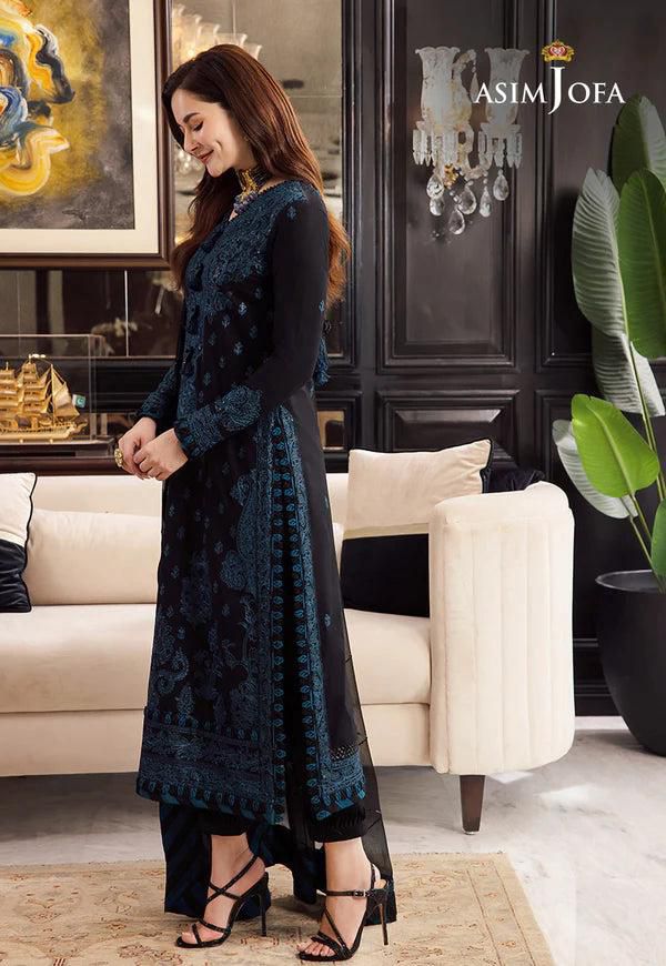 Model wearing Asim Jofa luxury chiffon embroidered 3 piece suit showing elegant side view